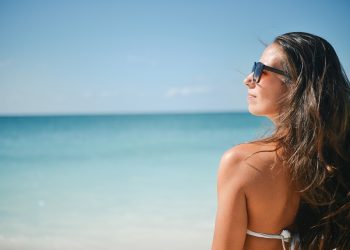 a woman in a garment on a beach