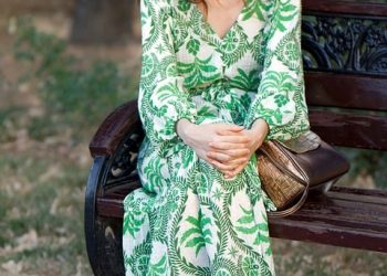 a woman sitting on a bench