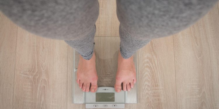 a person standing on a scale